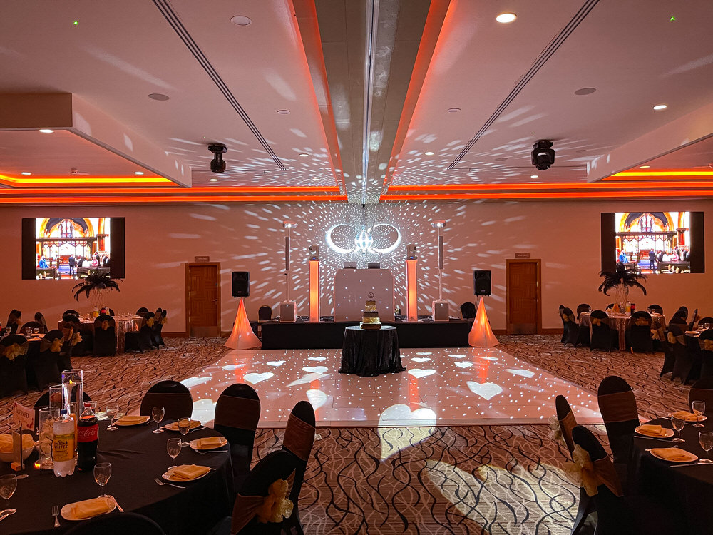 Blue Diamond Entertainment professional wedding DJ setup with warm amber uplighting and starlit dance floor at a Shropshire wedding venue