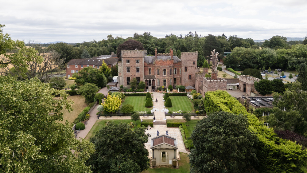 Aerial view of Rowton Castle wedding venue, an exclusive-use 17th-century castle set in 17 acres of formal gardens near Shrewsbury, Shropshire